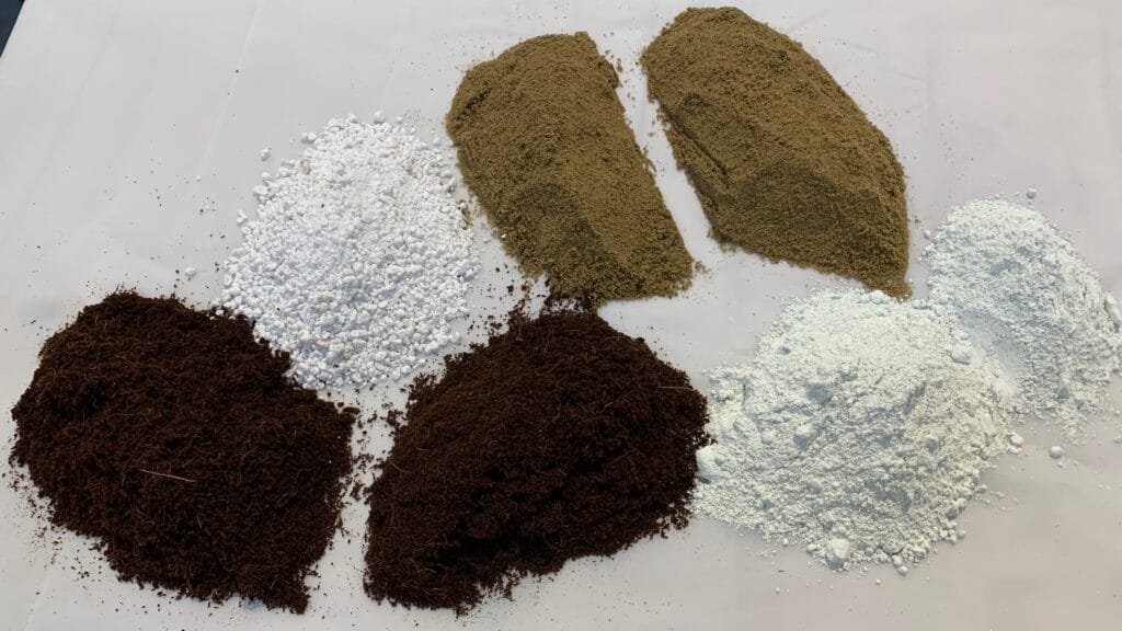 The raw materials used to make hypertufa: peat moss, sand, perlite, and cement
