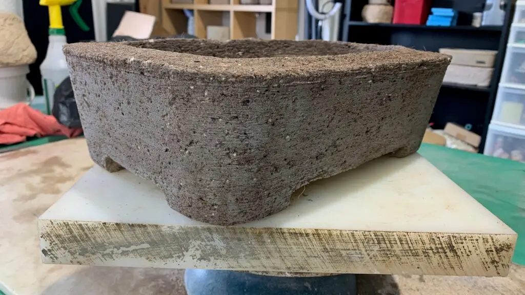 Hypertufa planter showing deep brown color while still wet, before the curing process begins.